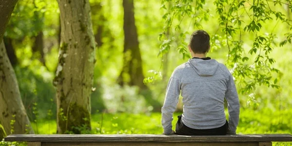 young-adult-man-sitting-on-600nw-2457704173